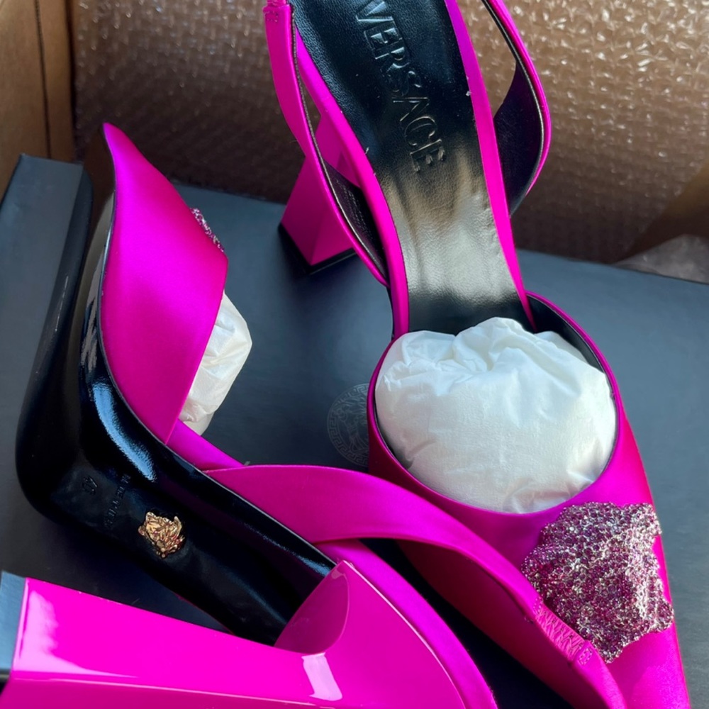 fuchsia pink heels with diamond pink stone medusa head on top